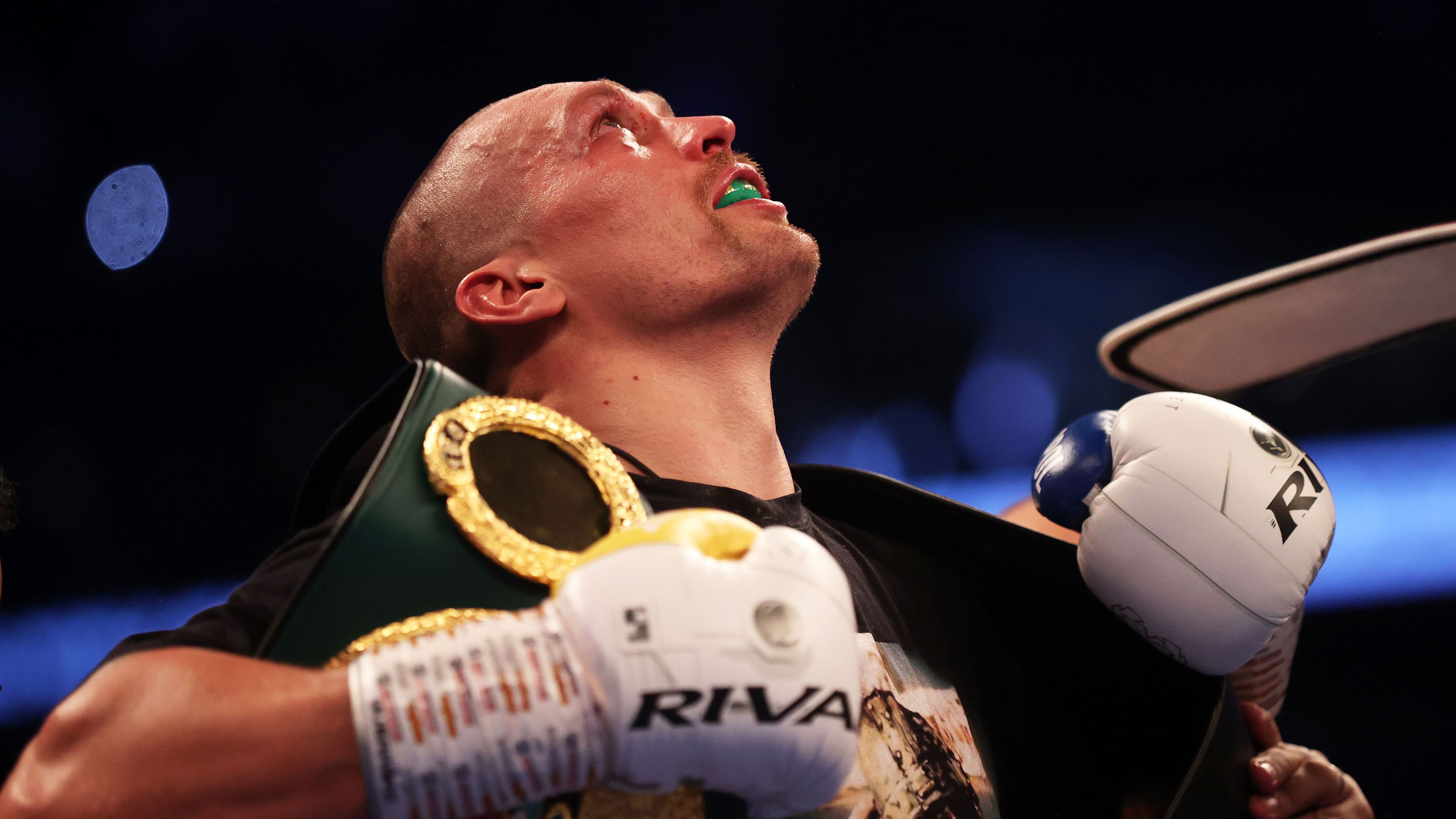 Oleksandr Usyk celebrates after being crowned the new world champion after defeating Anthony Joshua in a heavyweight title fight.