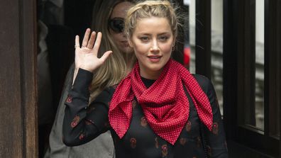 Actress Amber Heard gestures as she arrives at the High Court for a hearing in Johnny Depp's libel case, in London, Wednesday July 15, 2020.