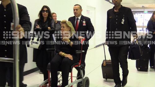 Ms Packer was wheeled to her gate by airline staff. (9NEWS)