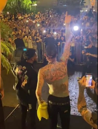 Machine Gun Kelly performs outside his Paraguay hotel.