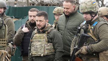 Ukrainian President Volodymyr Zelenskyy examines the site of a recent battle in Bucha close to Kyiv, Ukraine on April 4, 2022