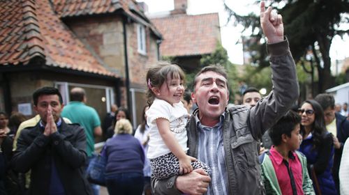 A man reacts to the unfolding referendum results. (AAP)