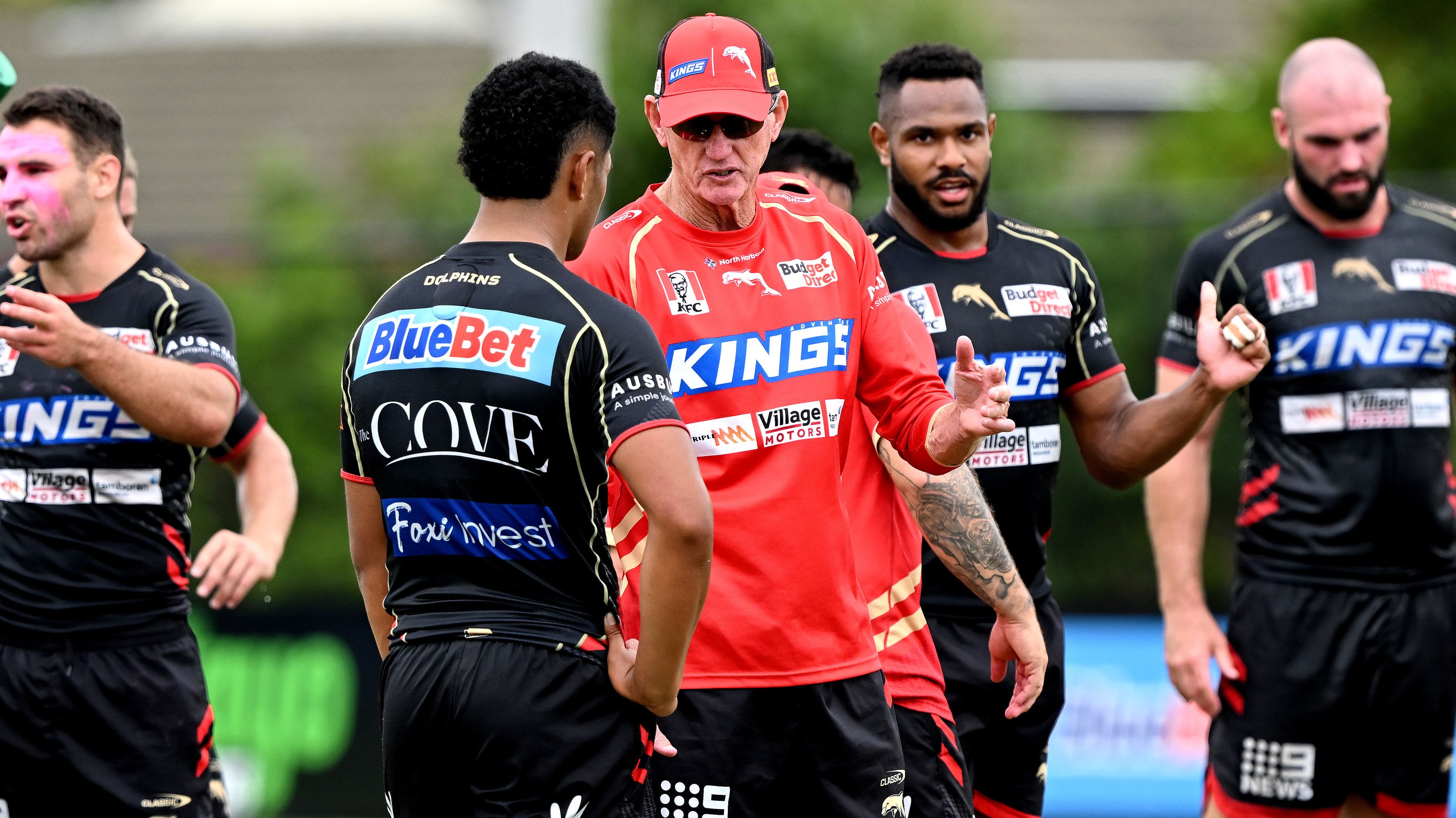 Coach Wayne Bennett talks with Isaiya Katoa during a Dolphins training session. (Photo by Bradley Kanaris/Getty Images)