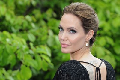Angelina plays the villain in <i>Maleficent</i>, but she looks purely angelic here!