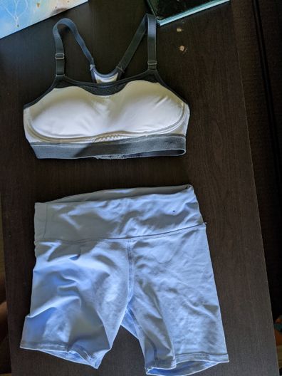 Flatlay photo of a sports bra and gym shorts