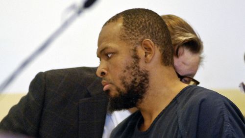 Siraj Ibn Wahhaj, confers with one of his attorneys at a first appearance in New Mexico district court in Taos, on accusations of child abuse and abducting his son from the boy's mother.