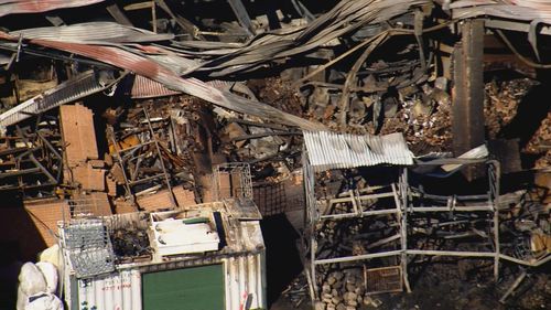 An enormous fire at a factory complex in Sydney's west has wiped out several businesses, with the damage and losses expected to run into the millions of dollars.