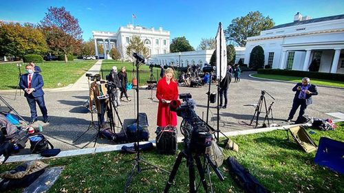 'It's on': Nine US Correspondent Adams checks her notes as she prepares for the camera to roll.