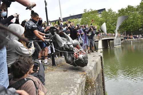 Edward Colston, Bristol's most famous philanthropist, is pushed into the harbour.