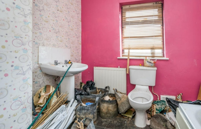 Shocking photos have emerged of a home's dire interiors in Wigan, England. 