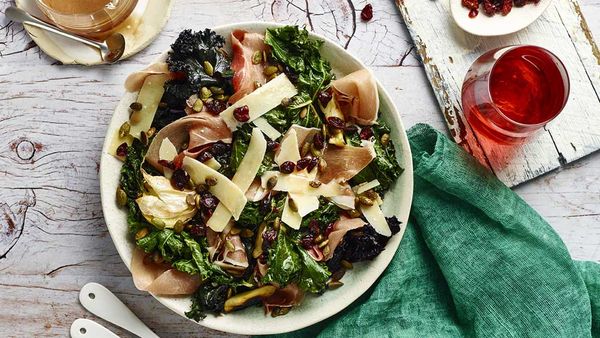 Kale salad with prosciutto, pumpkin seeds and cranberry balsamic vinaigrette