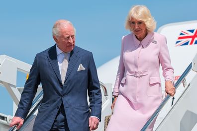 JOINT BASE ANDREWS, MD - APRIL 27: King Charles III and Queen Camilla disembark from their plane as they arrive on the first day of their state visit to the United States April 27, 2026 at Joint Base Andrews, Maryland. The visit includes stops in the nation's capital, New York City, and Virginia, organized to celebrate the 250th anniversary of its independence from the United States of America. (Photo by Chip Somodevilla/Getty Images)