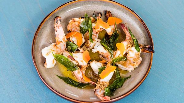 Chargrilled prawns with pickled tumeric, brown butter and crispy curry leaves
