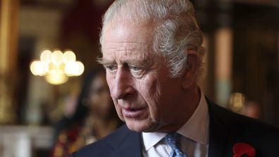 King Charles III talks with guests during a reception and ceremony commemorating the 50th anniversary of the Resettlement of British Asians from Uganda in the UK, at Buckingham Palace in London, Nov. 2, 2022 