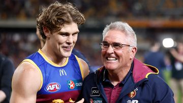 BRISBANE, AUSTRALIA - SEPTEMBER 23: Deven Robertson (left) and Chris Fagan, Senior Coach of the Lions celebrate during the 2023 AFL Second Preliminary Final match between the Brisbane Lions and the Carlton Blues at The Gabba on September 23, 2023 in Brisbane, Australia. (Photo by Michael Willson/AFL Photos via Getty Images)