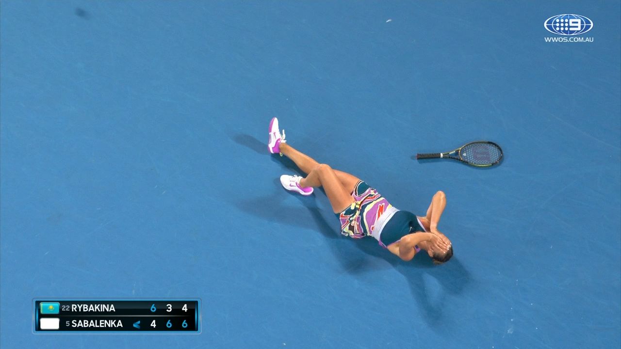 Aryna Sabalenka collapses to the court crying after come-from-behind victory in epic Australian Open final