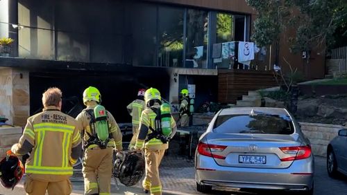 An Aston Martin car has been wrecked in a fire involving an e-scooter in Sydney.