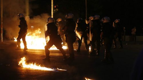 Streets on fire as petrol bombs thrown outside Greek parliament
