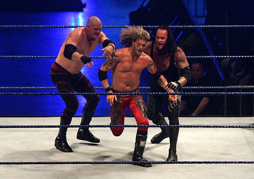 Wrestling fighters Kane (L), Edge (C) and Undertaker (R) fight during the WWE Smackdown Wrestling at Arena Monterrey on May 9, 2010 in Monterrey, Mexico.