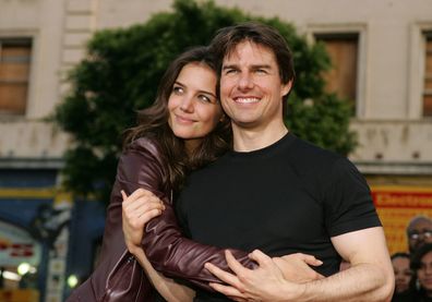 Tom Cruise and Katie Holmes arrive at the Los Angeles Fan Screening of War of the Worlds at the Grauman's Chinese Theatre on June 27, 2005 in Hollywood, California.