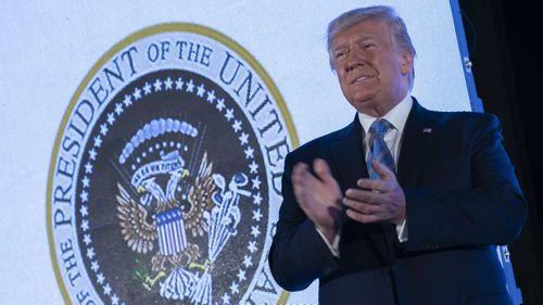 Donald Trump did not notice the presidential seal was mocking him.