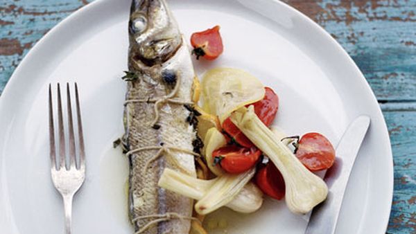 Whole whiting roasted with tomato, lemon and young garlic