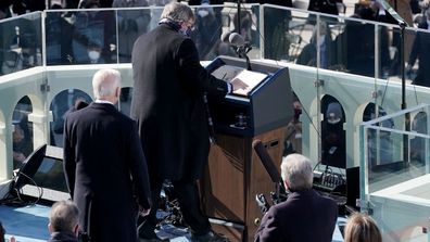 The podium is cleaned prior to President Joe Biden giving his inaugural address during the 59th Presidential Inauguration on January 20, 2021 in Washington, DC. During today's inauguration ceremony Joe Biden becomes the 46th president of the United States.