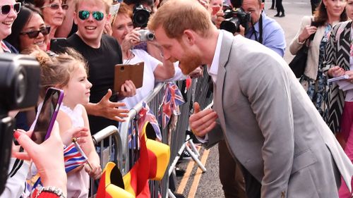 Harry met many people who were very excited to catch a glimpse of him. (Getty)