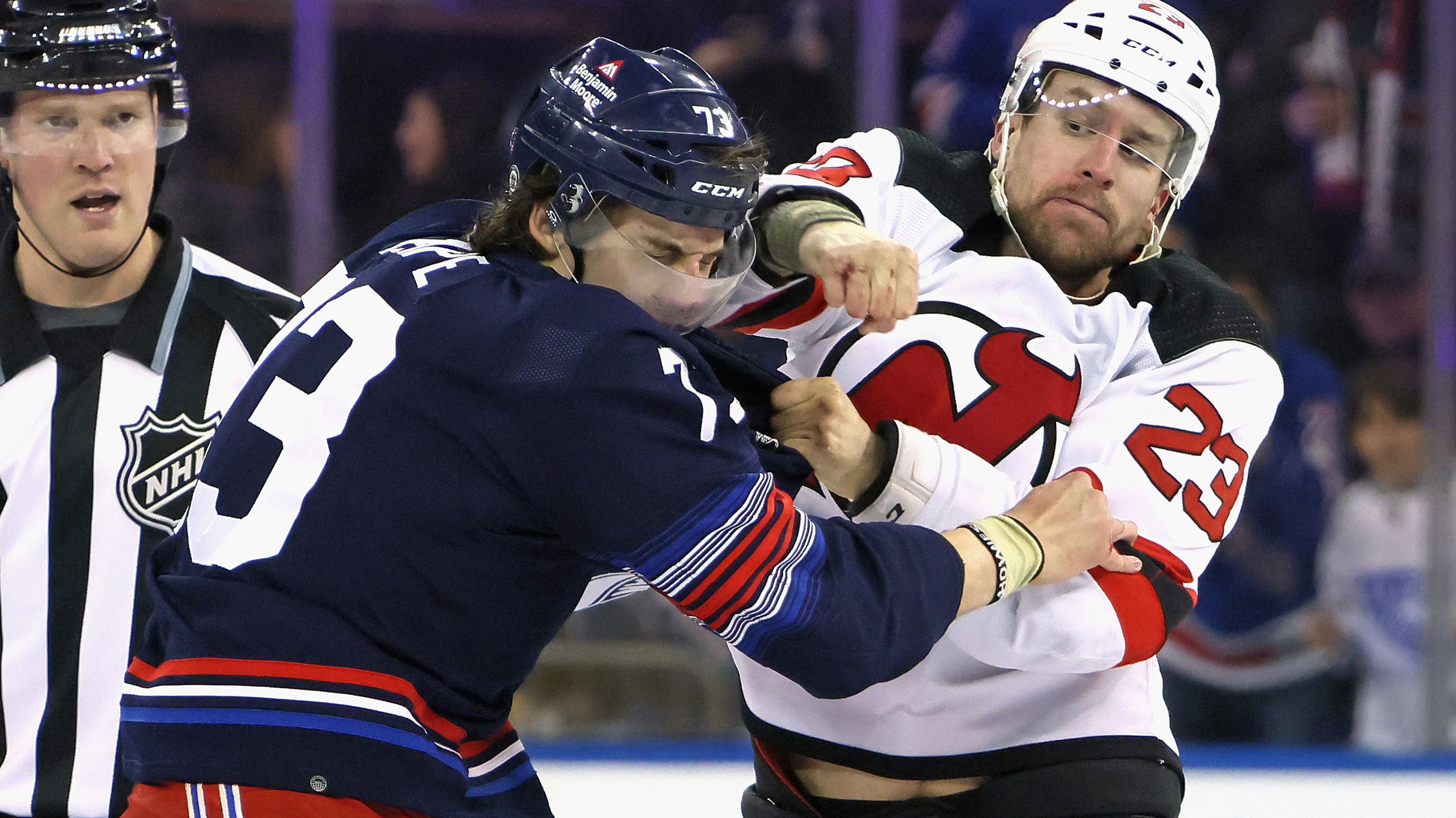 Kurtis MacDermid of the New Jersey Devils fights with Matt Rempe of the New York Rangers.