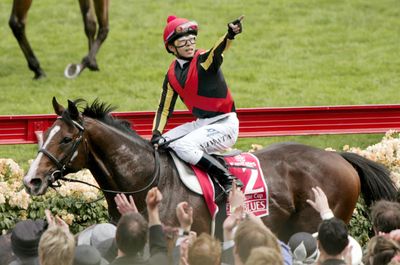 Yasunari Iwata with the horse Delta Blues after the 2006 Melbourne Cup