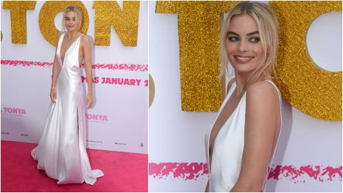 Robbie floated down the pink carpet in an angelic white gown. (AAP)
