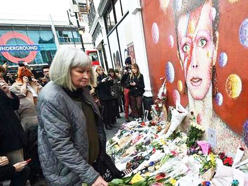 Fans gather to dance and sing in David Bowie's hometown of Brixton