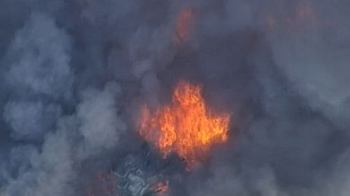 The inferno broke out at a scrap metal yard in Wacol yesterday.