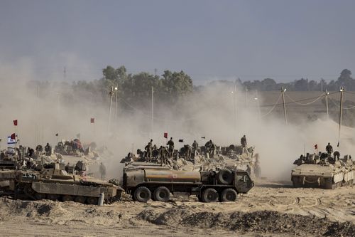 Israeli troops are seen near the border with Gaza on August 6.