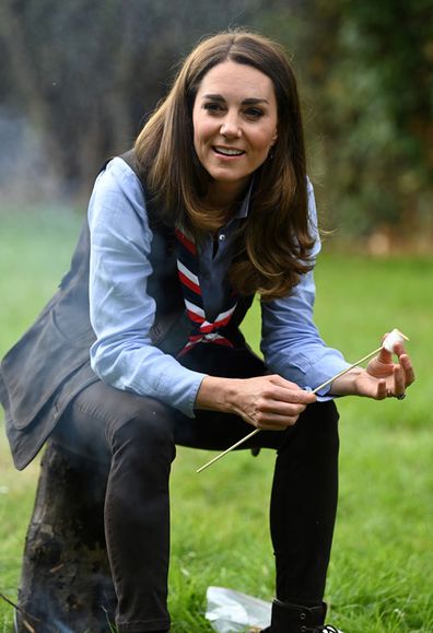 Duchess of Cambridge toasts marshmallows during her visit to a Scout Group in Northolt, northwest London where she joined Cub and Beaver Scouts in outdoor activities on September 29, 2020 in London, England