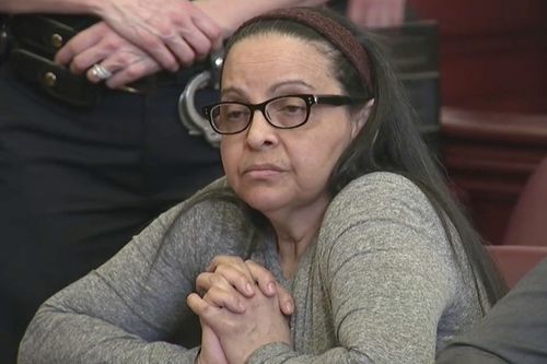 In this image from video, Yoselyn Ortega, a trusted nanny to a well-to-do family, listens to court proceedings during the first day of her trial,in New York, Thursday, March 1, 2018. In October 2012 Ortega took two young children in her care into a bathroom at their Manhattan apartment, slaughtered them with a knife and then slit her own throat. (WYNY-TV/Pool Photo via AP)