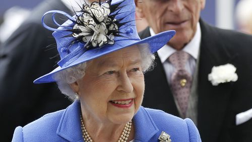 Queen Elizabeth and Prince Philip arrive for the Epsom Derby at Epsom race course, southern England at the start of four-day Diamond Jubilee celebrations to mark the 60th anniversary of the Queen's accession to the throne Saturday, June 2, 2012. 