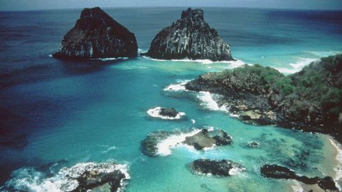 An aerial view April 1997 of the National Marine Park of Fernando De Noronha, Brazil where over 700 spinner dolphins enjoy life in the Bay of Dolphins, a protected cove. (AP)