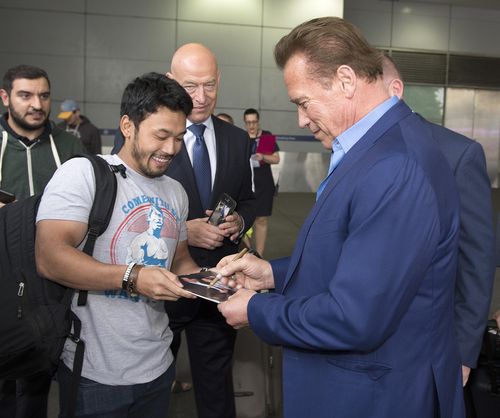 Arnie was mobbed by fans after touching down in Melbourne. (AAP)
