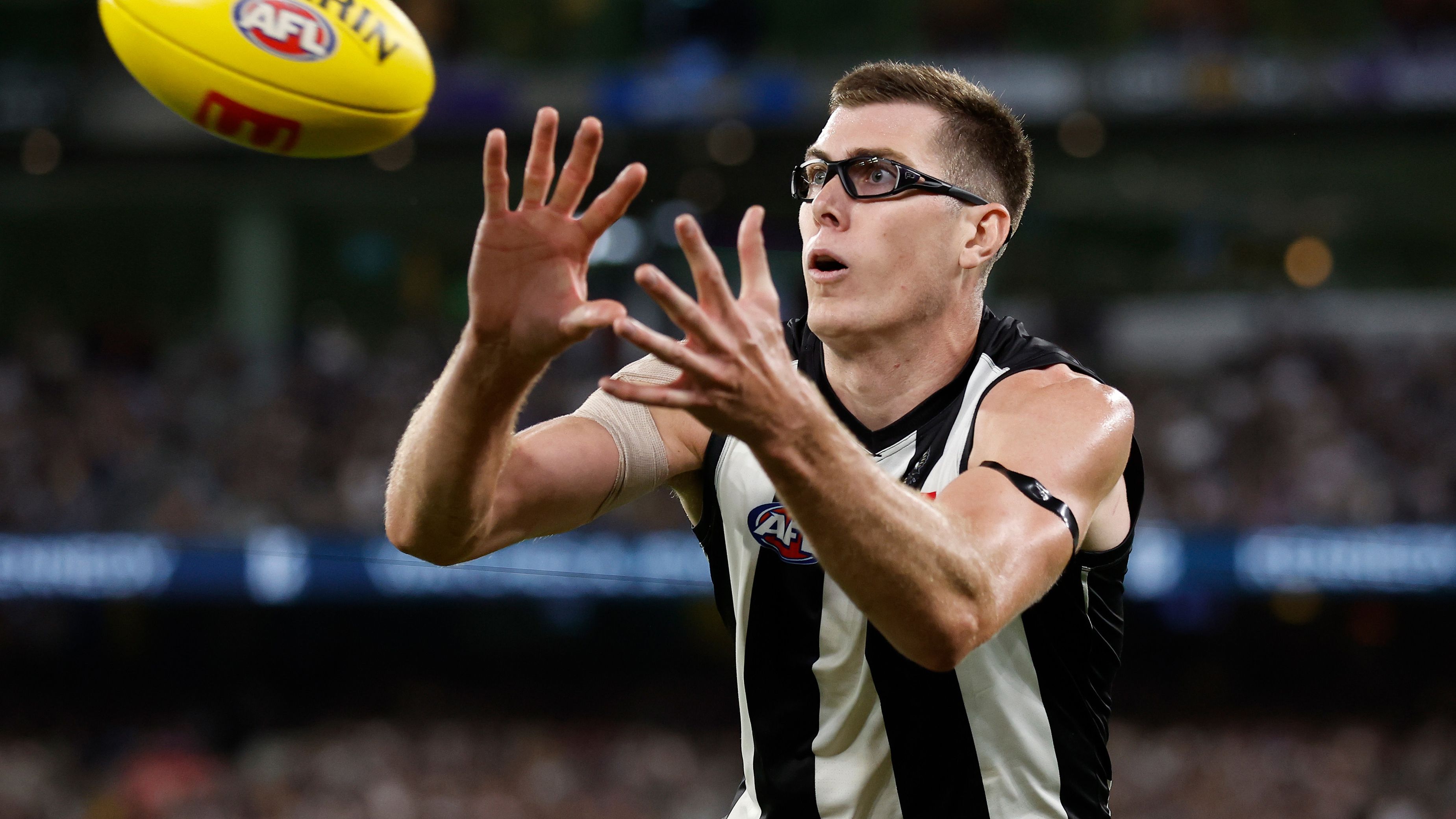 MELBOURNE, AUSTRALIA - MARCH 17: Mason Cox of the Magpies marks the ball during the 2023 AFL Round 01 match between the Geelong Cats and the Collingwood Magpies at the Melbourne Cricket Ground on March 17, 2023 in Melbourne, Australia. (Photo by Michael Willson/AFL Photos)