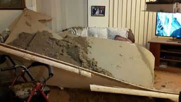 Couple sit down to watch the news, then the ceiling suddenly collapses