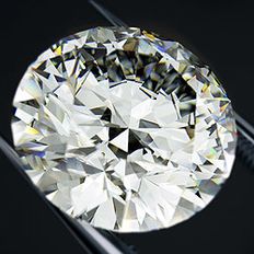 Stock image of diamond held in tweezers (Getty)