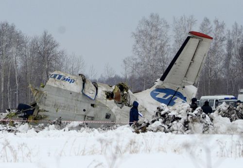 Russian Emergency ministry rescue workers search the site of the ATR-72 plane crash outside Tyumen, a major regional center in Siberia, Russia, Monday, April 2, 2012. A passenger plane crashed in Siberia shortly after take-off on Monday morning, killing 31 of the 43 people aboard, Russian emergency officials said, with 12 survivors were hospitalized in serious condition. The ATR-72, a French-Italian-made twin-engine turboprop, operated by UTair was flying from Tyumen to the oil town of Surgut with 39 passengers and four crew. (AP Photo/Marat Gubaydullin)