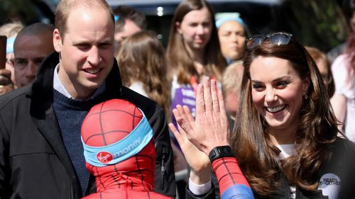 The Duke and Duchess of Cambridge and Prince Harry cheered on runners in the London Marathon. (AFP)