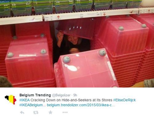 A woman found behind the red boxes during hide-and-seek game at Ikea. (supplied)