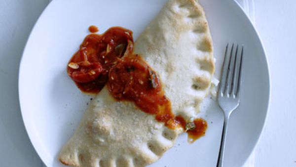 Three-cheese calzone with tomato-chilli sugo