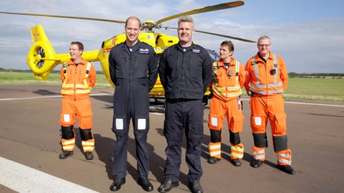 Prince William stands with colleagues at the start of his final shift. (AAP)
