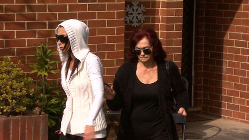 The woman's mother, right, pictured outside her home today. (9NEWS)