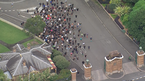 Goodge and his followers depart Centennial Park.