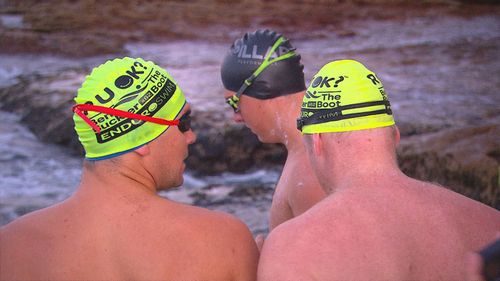 Man breaks record for number of laps swum at Bondi Beach for mental health awareness.